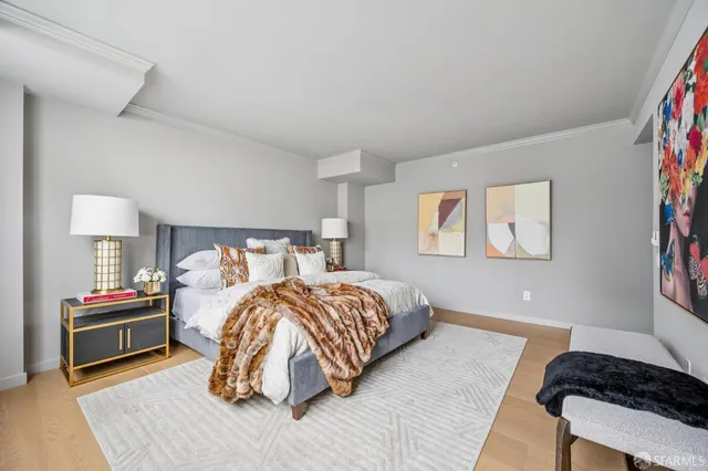 a bedroom with a bed and a couch