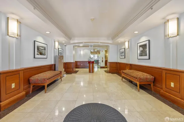 a living room with furniture and a pool table