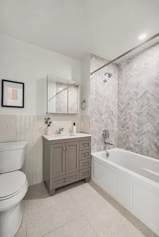 a kitchen with stainless steel appliances granite countertop a refrigerator sink and stove