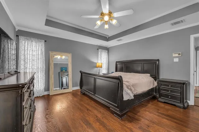 a bathroom with a tub a sink and a window