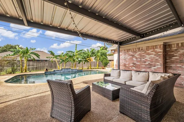 a view of a swimming pool with a yard