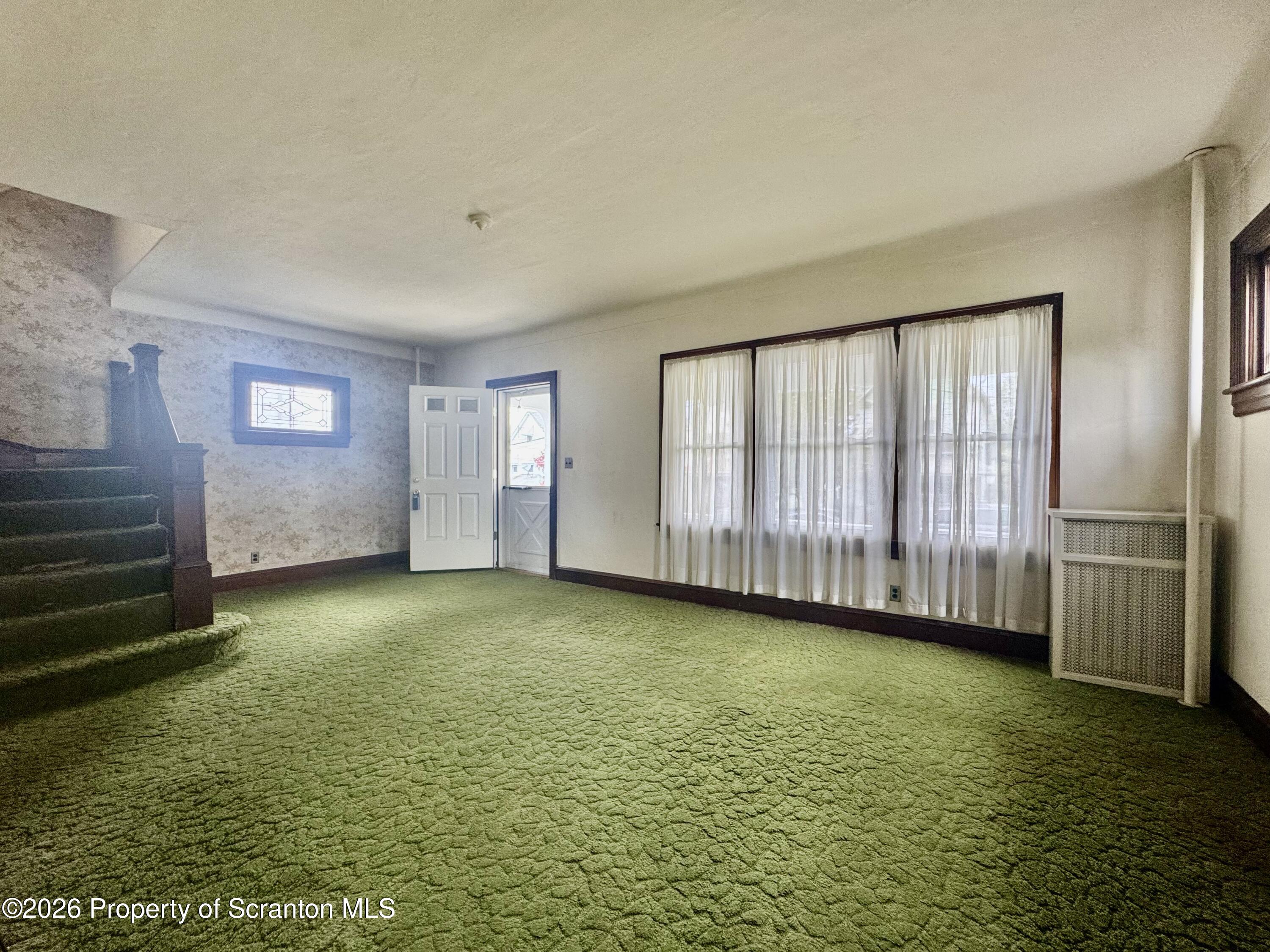 2120 Myrtle Street Scranton, PA 18510 - Photo 14 of 42 a view of an empty room with a fireplace