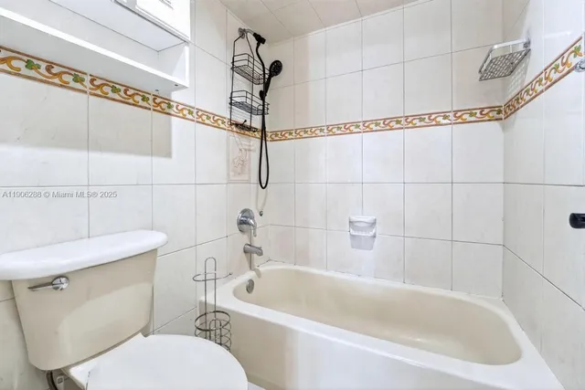 a view of a porch with wooden chairs
