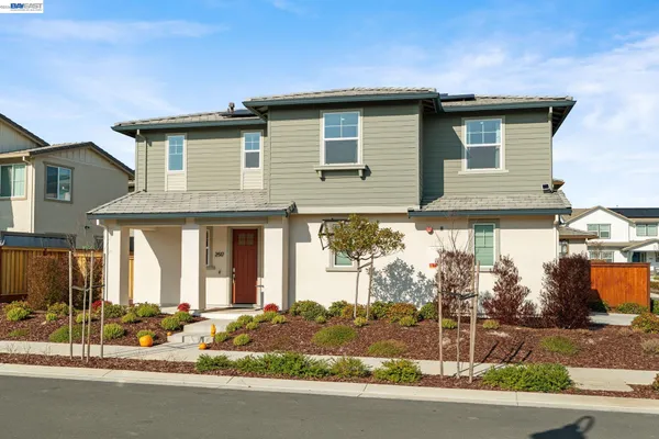 a front view of a house with a garage