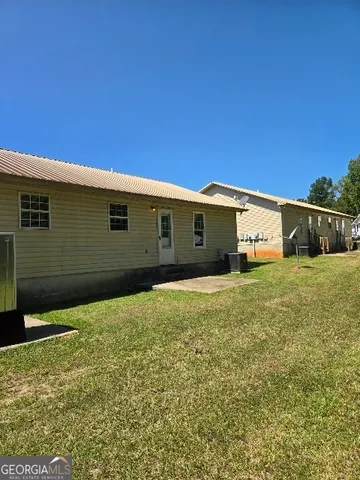 a house view with a backyard space