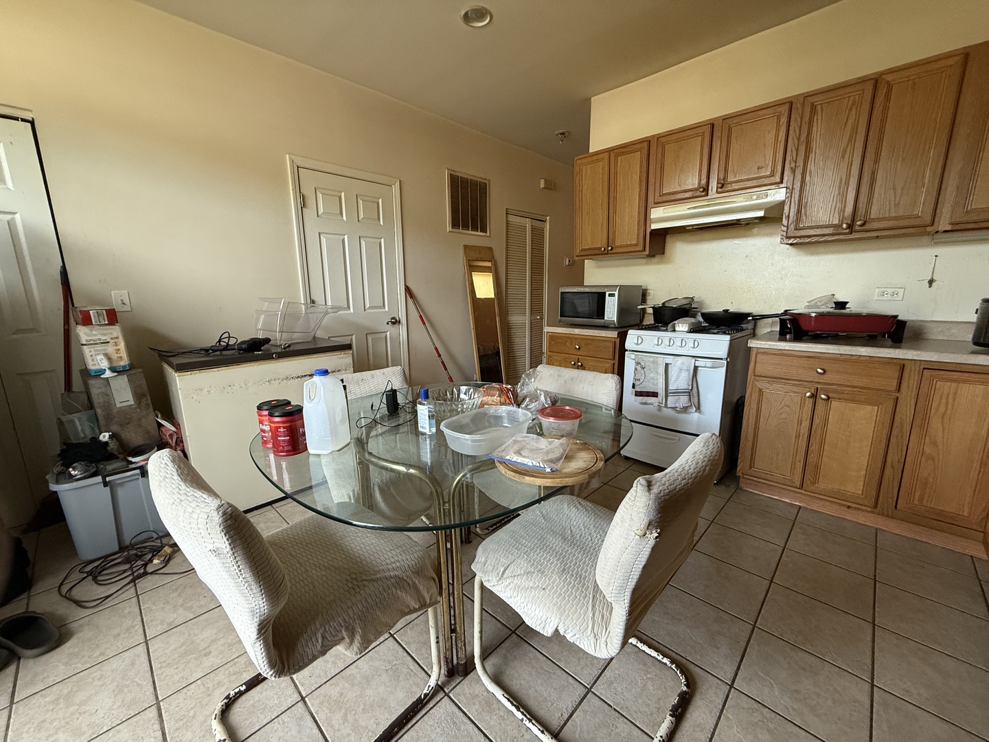 5416 West Thomas Street Chicago, IL 60651 - Photo 5 of 16 a kitchen with a dining table and chairs