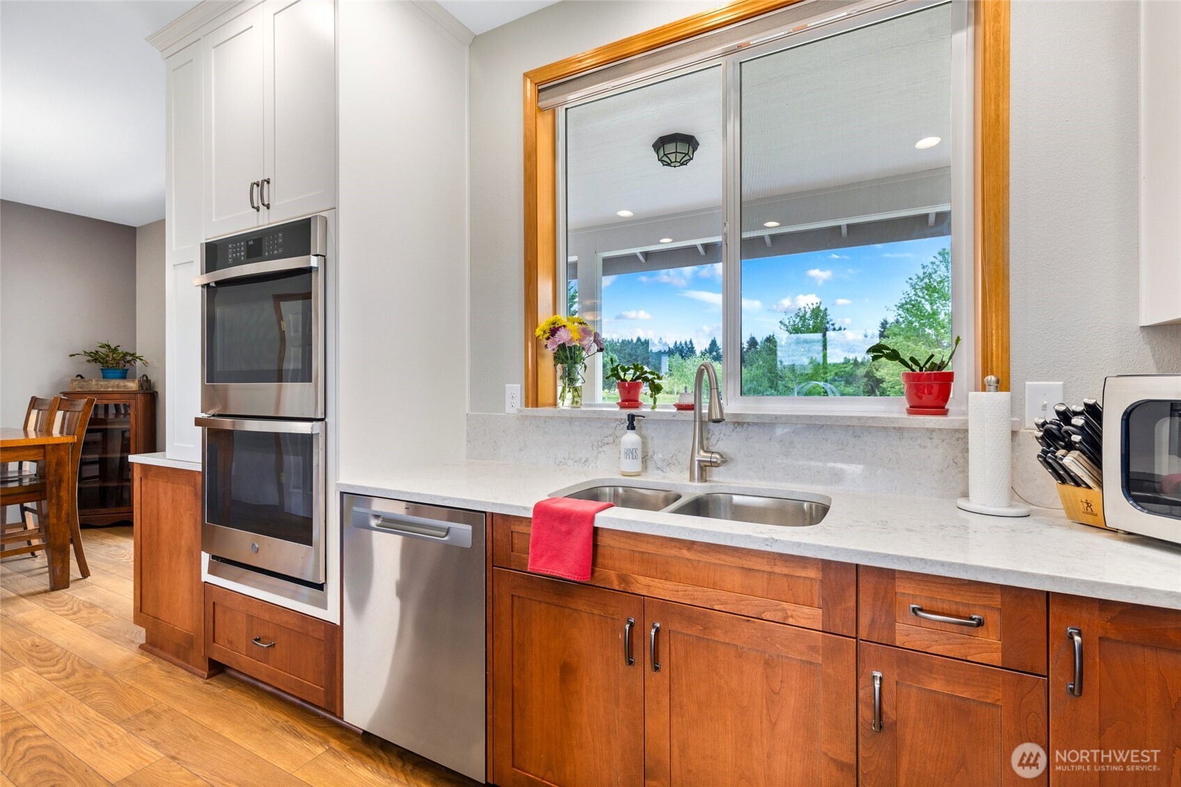 14419 Martinson Road Southeast Yelm, WA 98597 - Photo 12 of 39 a kitchen with stainless steel appliances a sink stove and cabinets