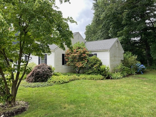 51 Jericho Road, Unit 51 Weston, MA 02493 - Photo 2 of 14 a house view with a garden