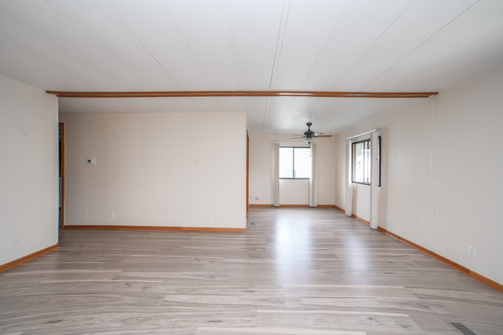 66 Maple Lane Manteno, IL 60950 - Photo 11 of 28 a view of an empty room with wooden floor and a window