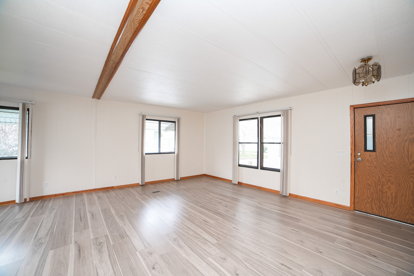 66 Maple Lane Manteno, IL 60950 - Photo 13 of 28 an empty room with wooden floor and windows