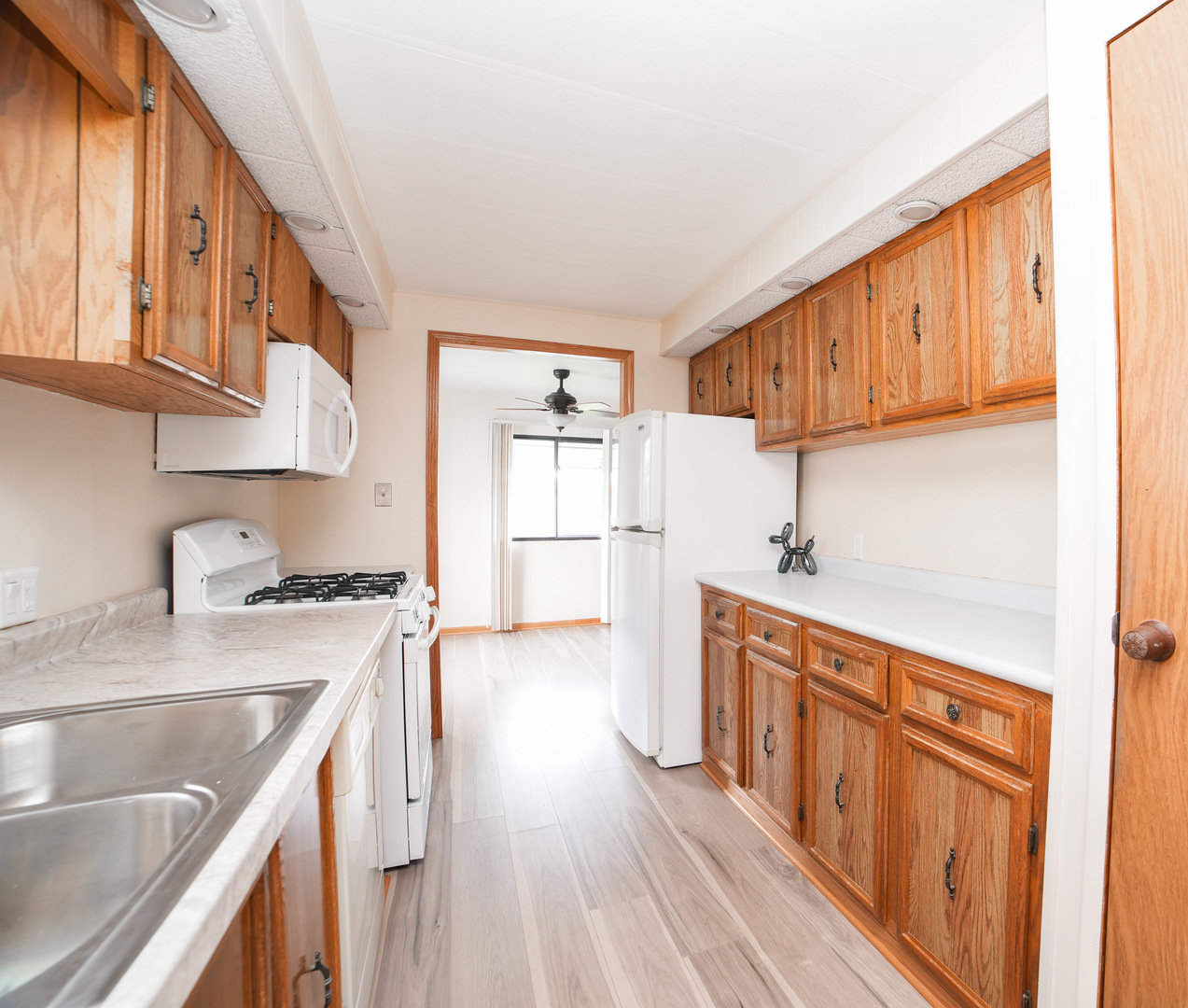 66 Maple Lane Manteno, IL 60950 - Photo 15 of 28 a kitchen with stainless steel appliances granite countertop a sink stove and cabinets