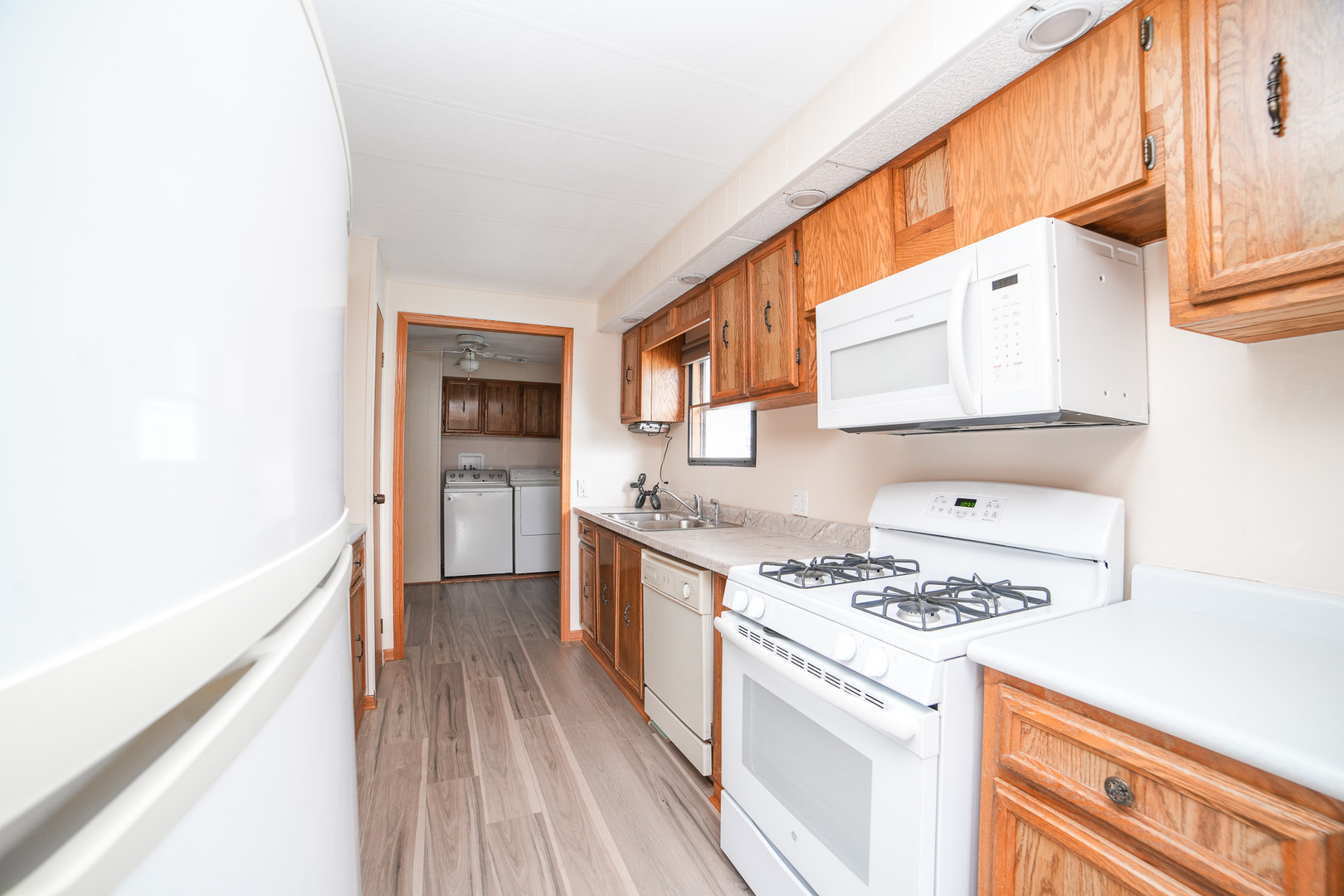 66 Maple Lane Manteno, IL 60950 - Photo 17 of 28 a kitchen with stainless steel appliances a stove a sink and a refrigerator