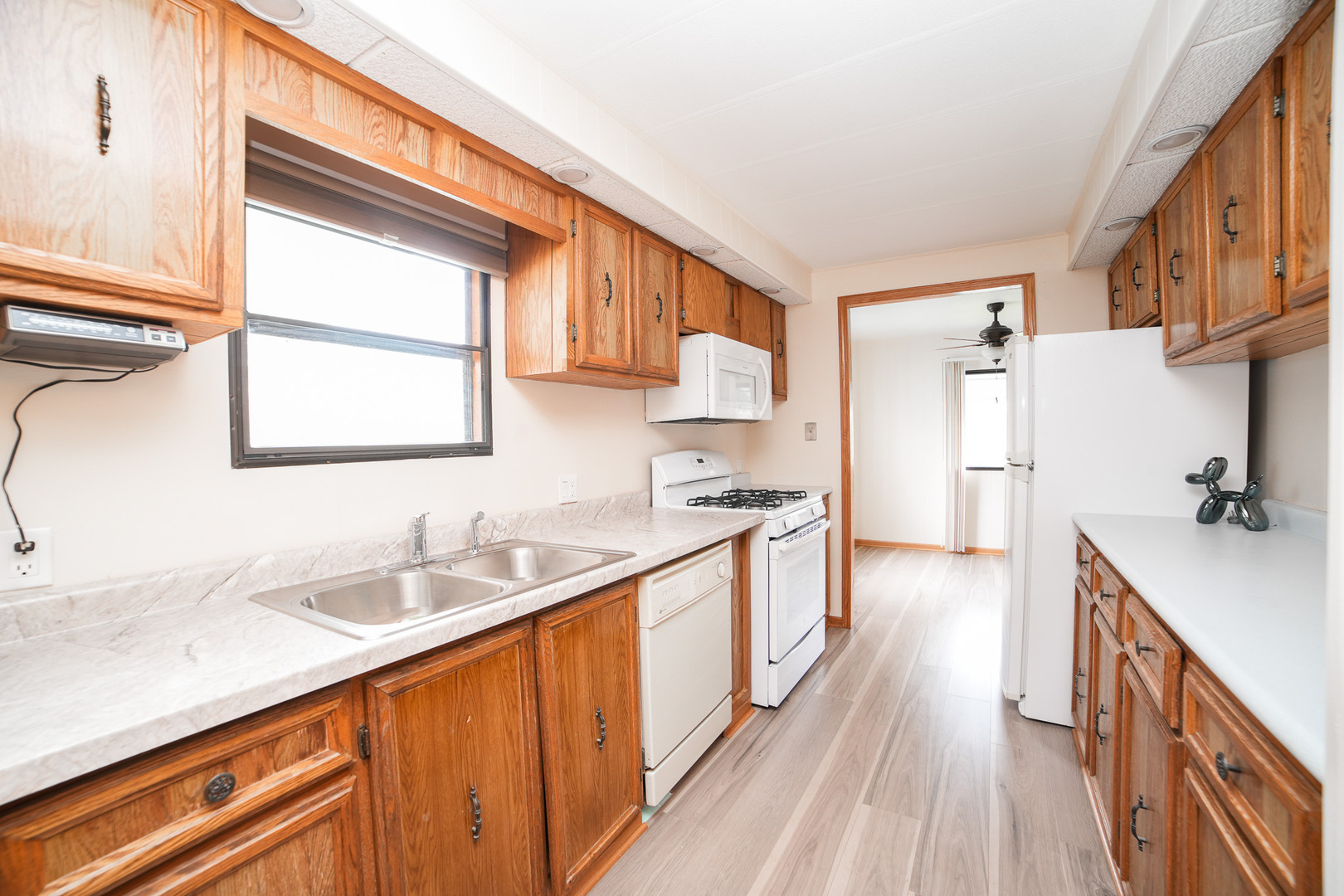 66 Maple Lane Manteno, IL 60950 - Photo 18 of 28 a kitchen with stainless steel appliances granite countertop a sink stove and refrigerator
