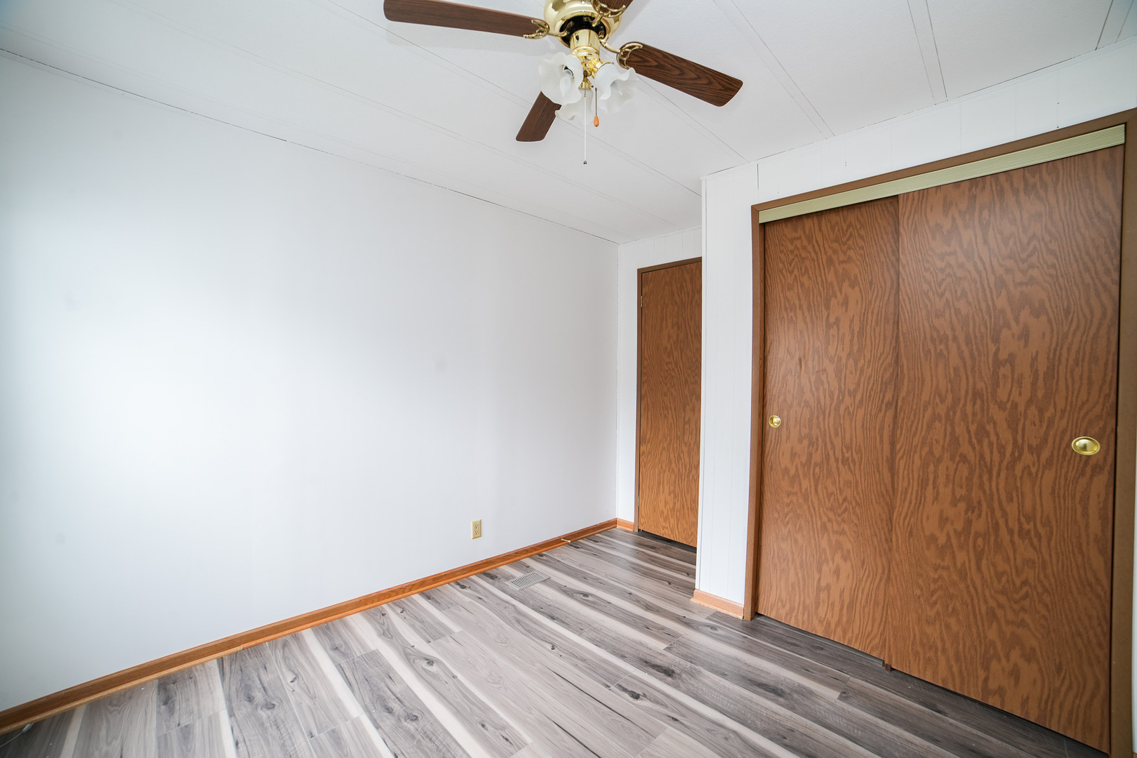 66 Maple Lane Manteno, IL 60950 - Photo 23 of 28 a view of empty room with wooden floor and fan
