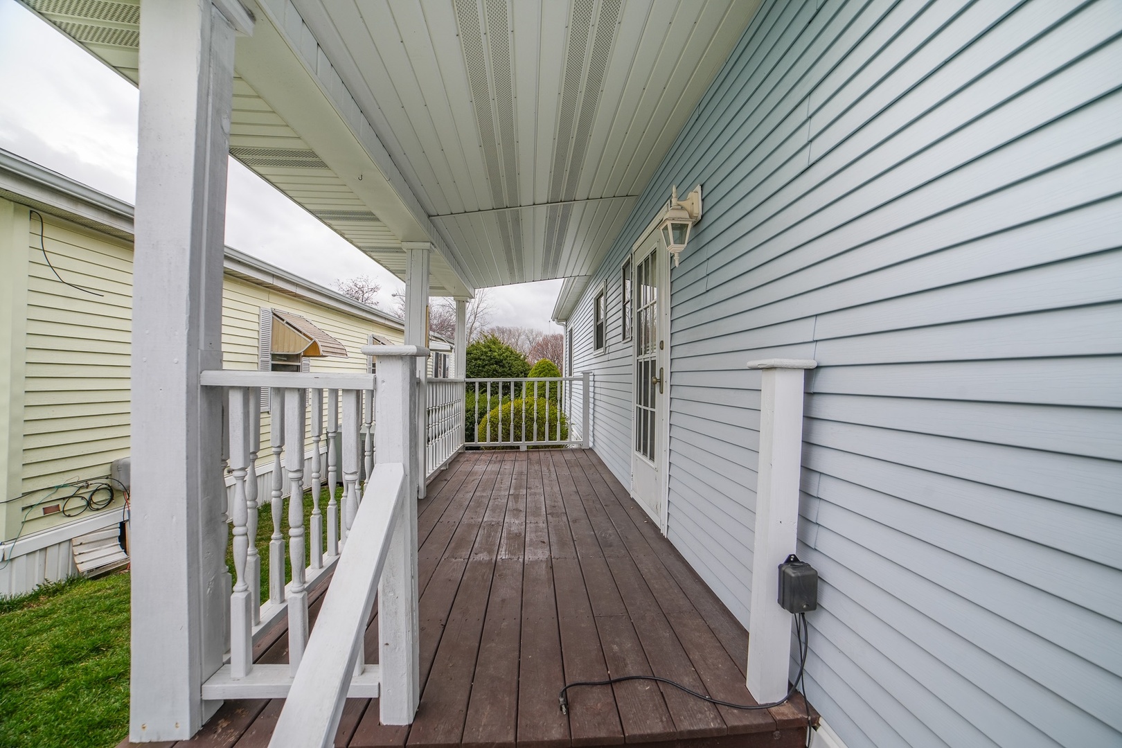 66 Maple Lane Manteno, IL 60950 - Photo 5 of 28 a view of a balcony with wooden floor