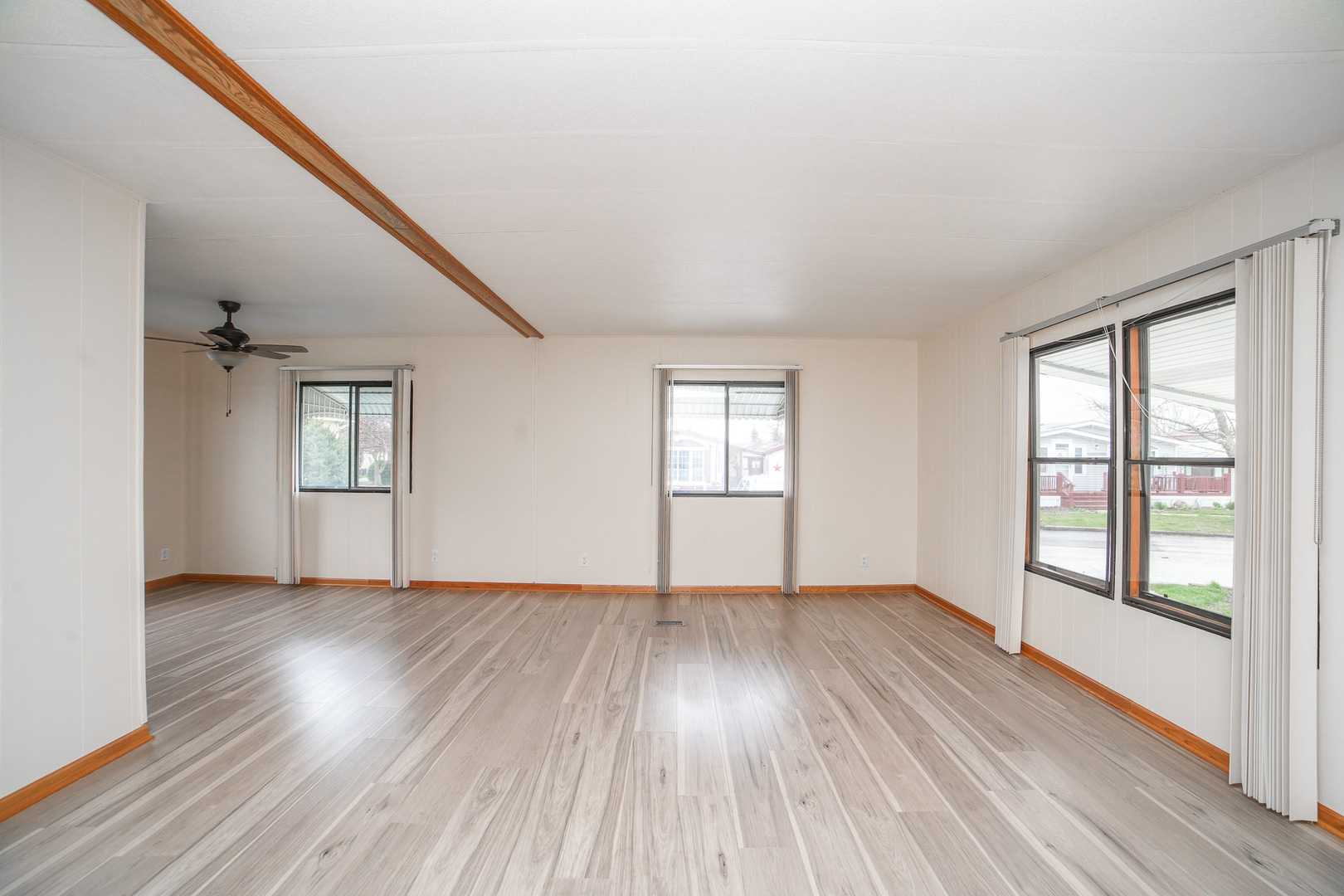 66 Maple Lane Manteno, IL 60950 - Photo 9 of 28 an empty room with wooden floor and windows