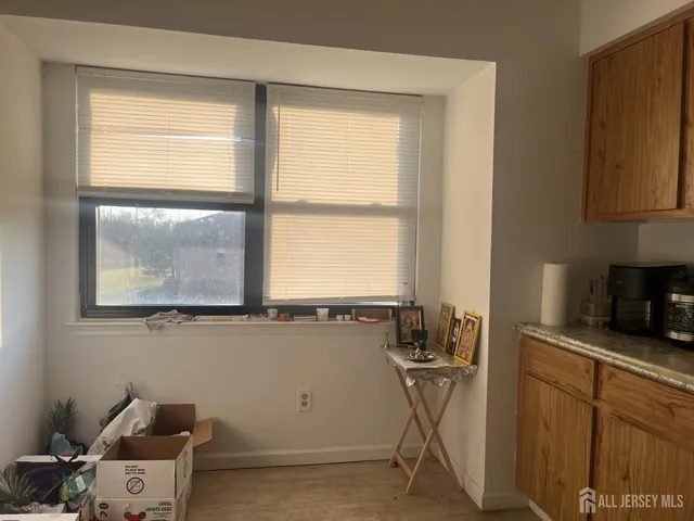 a room with a window cabinets and a table