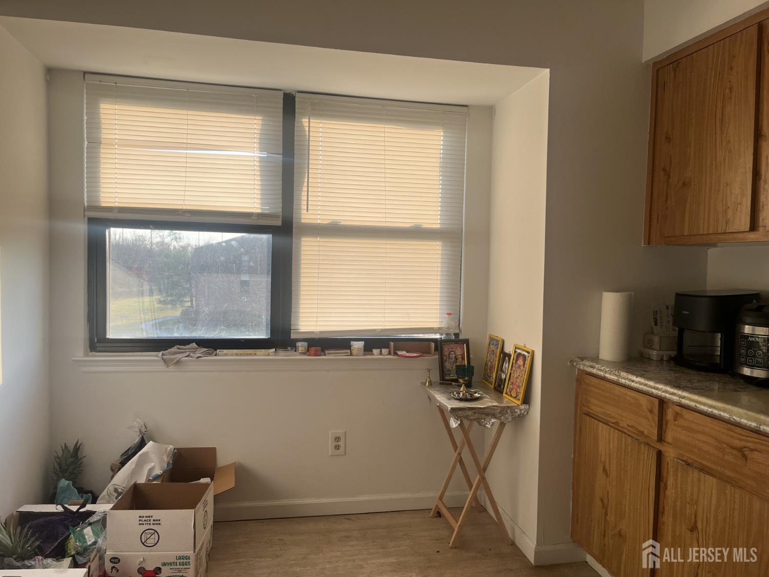 1947 Raspberry Court Edison, NJ 08817 - Photo 7 of 9 a room with a window cabinets and a table