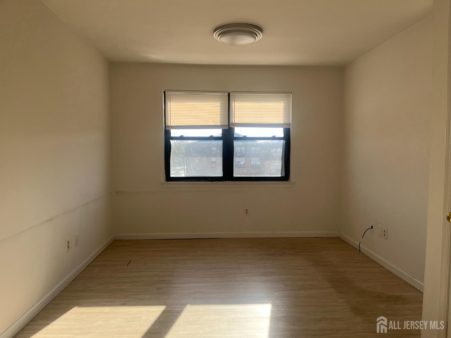 1947 Raspberry Court Edison, NJ 08817 - Photo 8 of 14 an empty room with a window