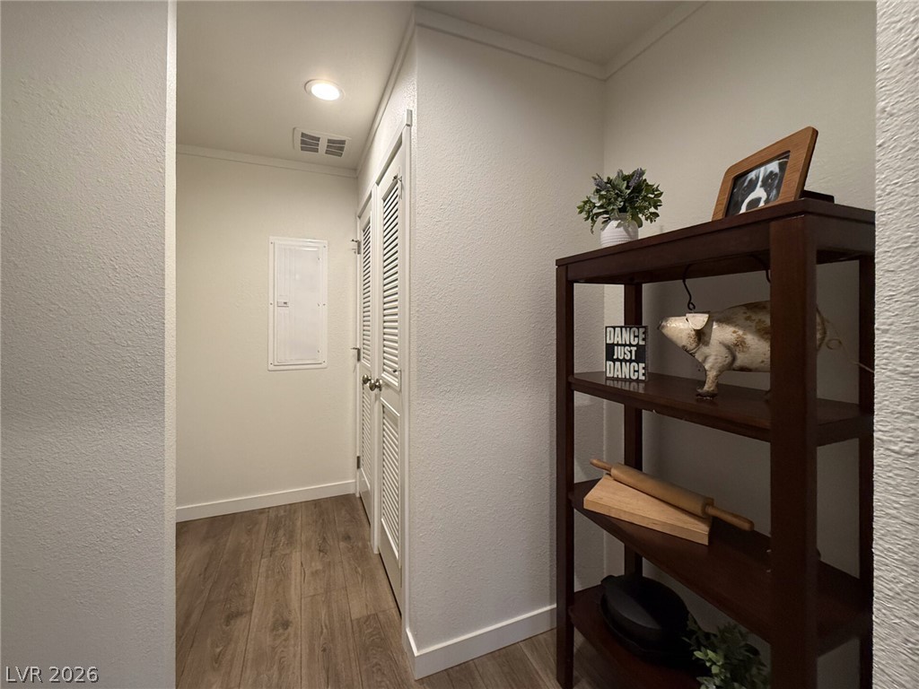 464 Box Canyon Road Alamo, NV 89001 - Photo 14 of 48 Smooth wood flooring and clean white trim highlight this hallway alcove.