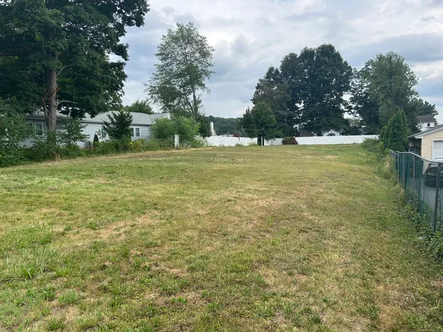 a view of a green field with clear sky
