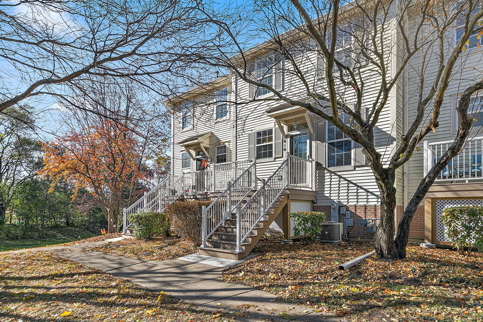 614 Littleton Trail Elgin, IL 60120 - Photo 2 of 30 a view of a white house with a large tree