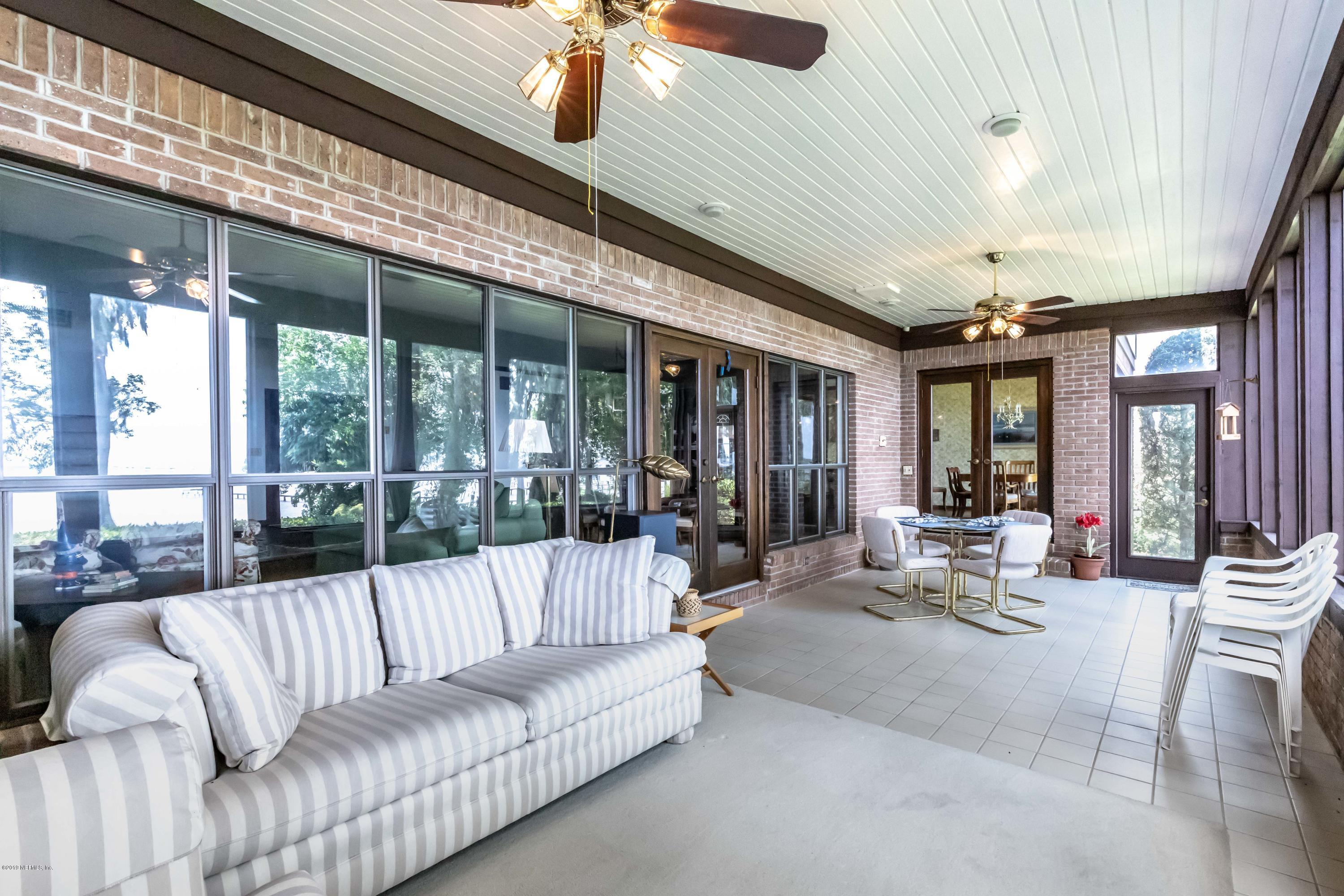 2911 Front Road Jacksonville, FL 32257 - Photo 11 of 71 a living room with furniture and a large window