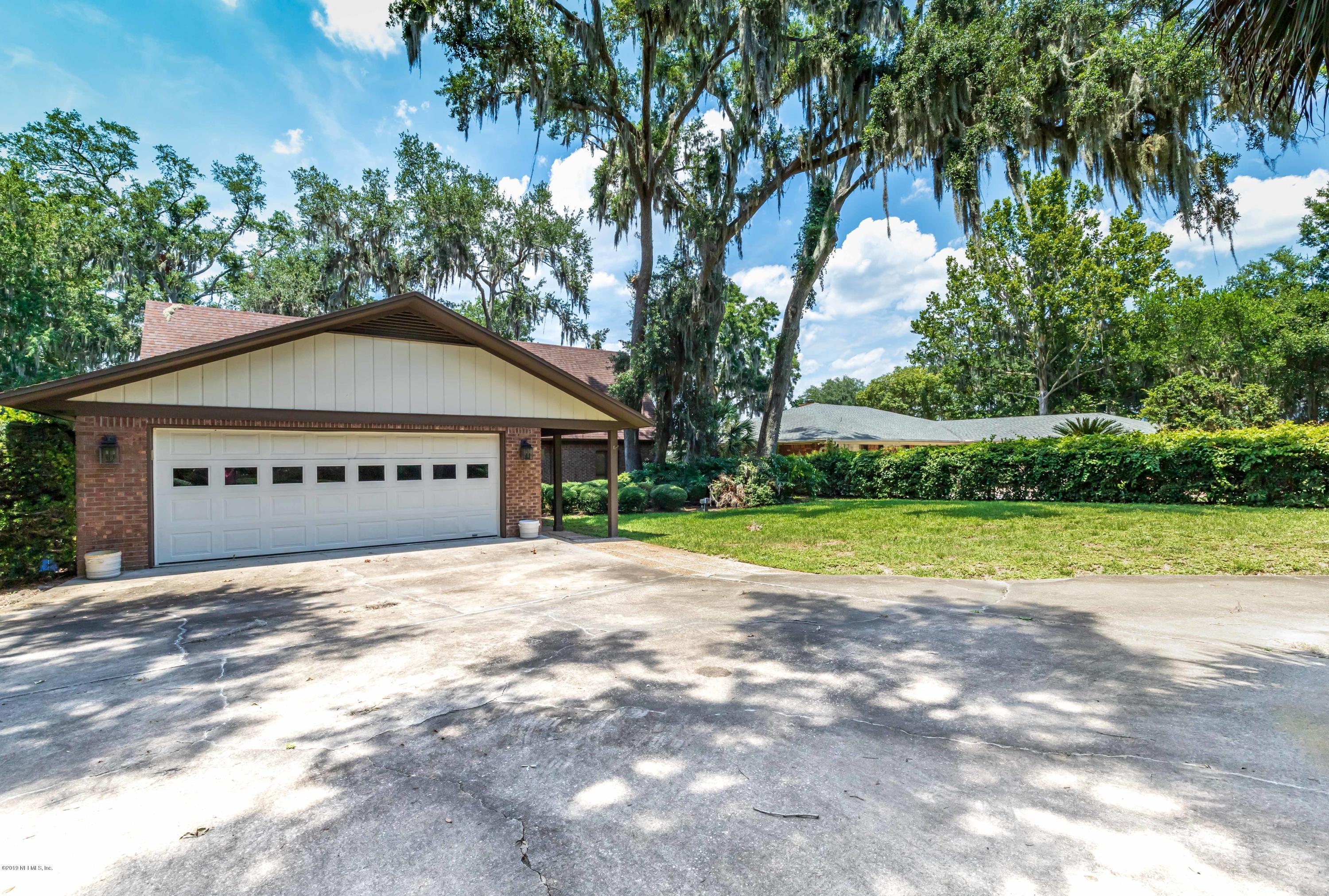 2911 Front Road Jacksonville, FL 32257 - Photo 18 of 71 a view of a house with a yard and large trees