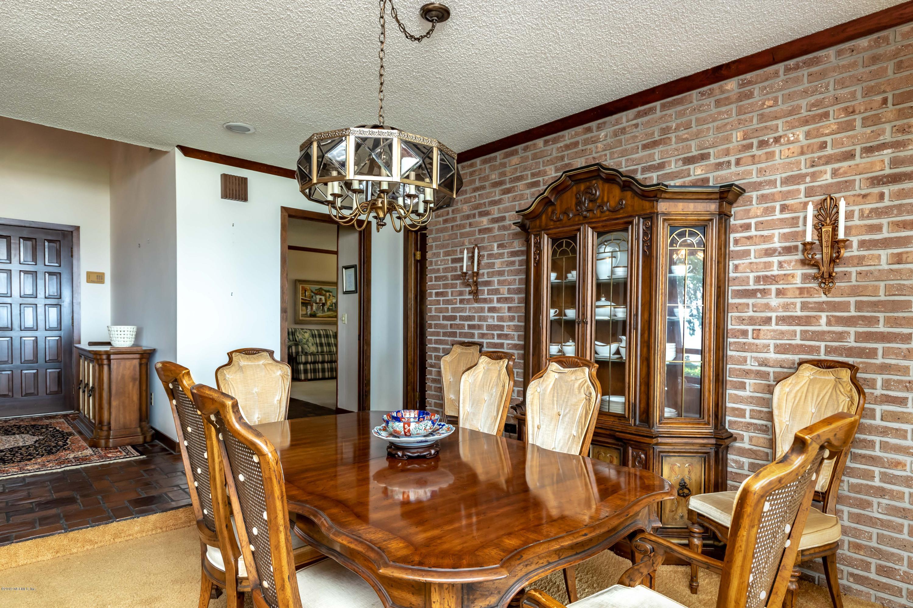 2911 Front Road Jacksonville, FL 32257 - Photo 24 of 71 a dining room with furniture a chandelier and window