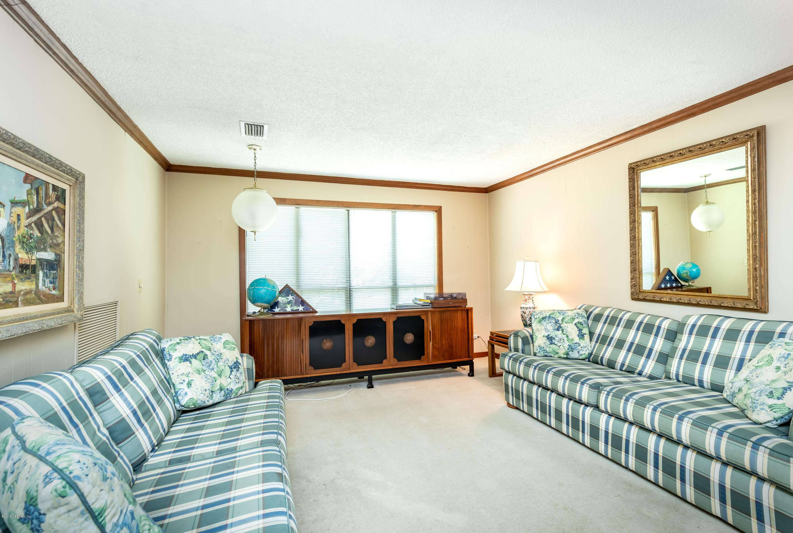 2911 Front Road Jacksonville, FL 32257 - Photo 27 of 71 a living room with furniture and a large window