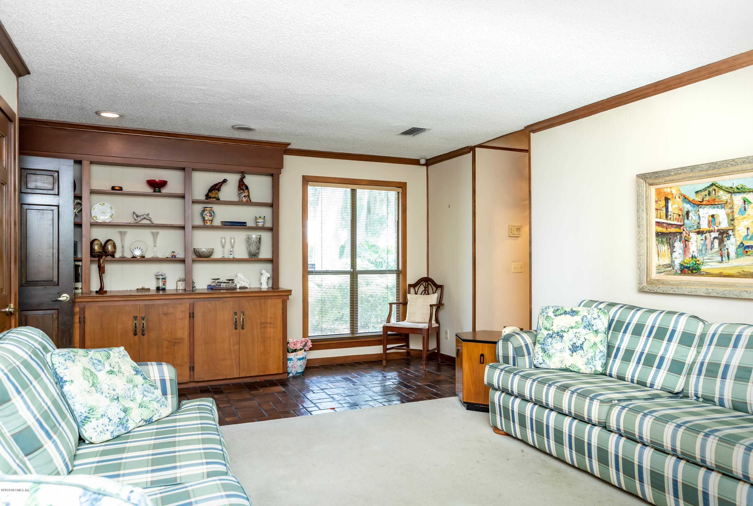 2911 Front Road Jacksonville, FL 32257 - Photo 30 of 71 a living room with furniture and a large window