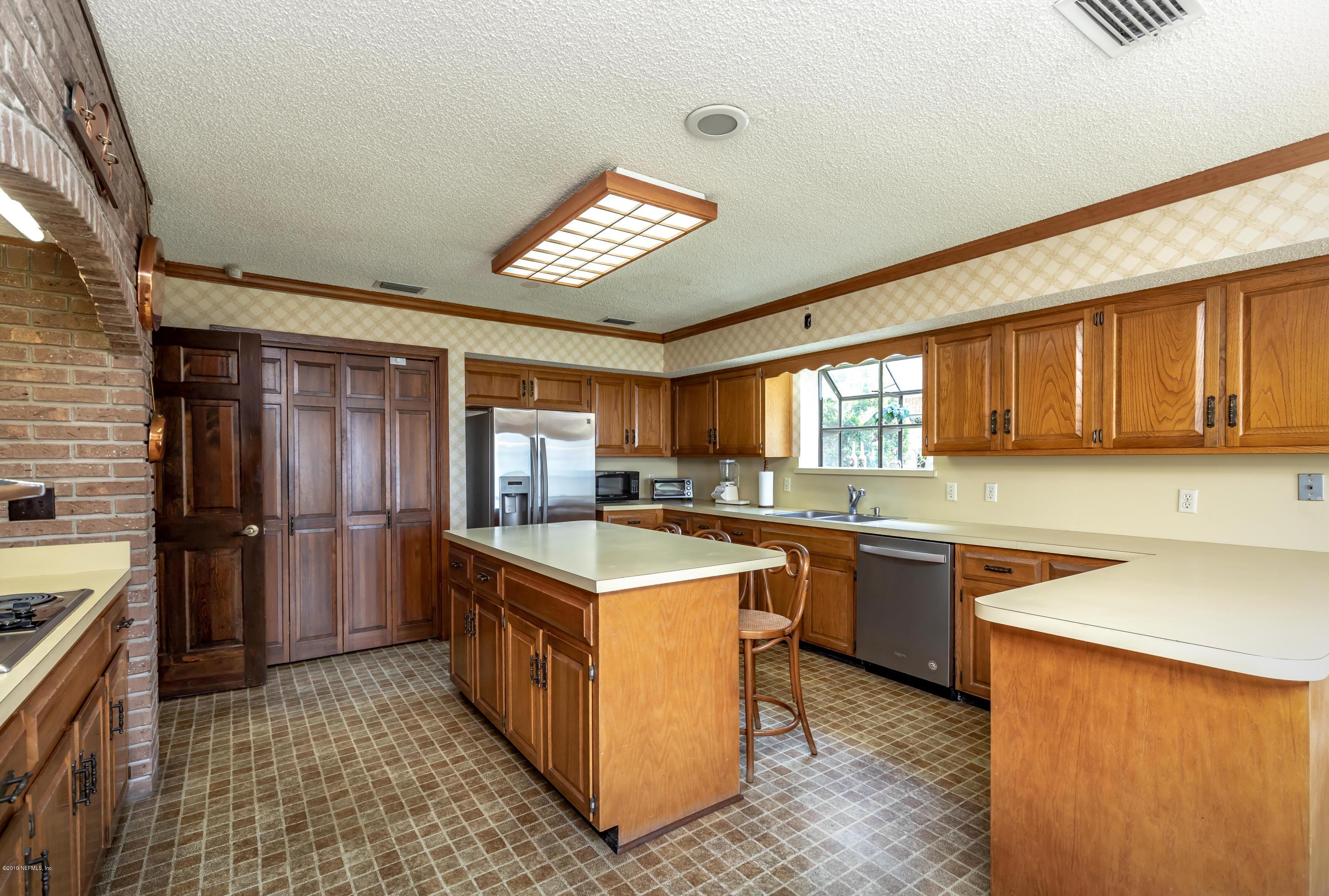 2911 Front Road Jacksonville, FL 32257 - Photo 31 of 71 a kitchen with stainless steel appliances granite countertop a stove and a sink