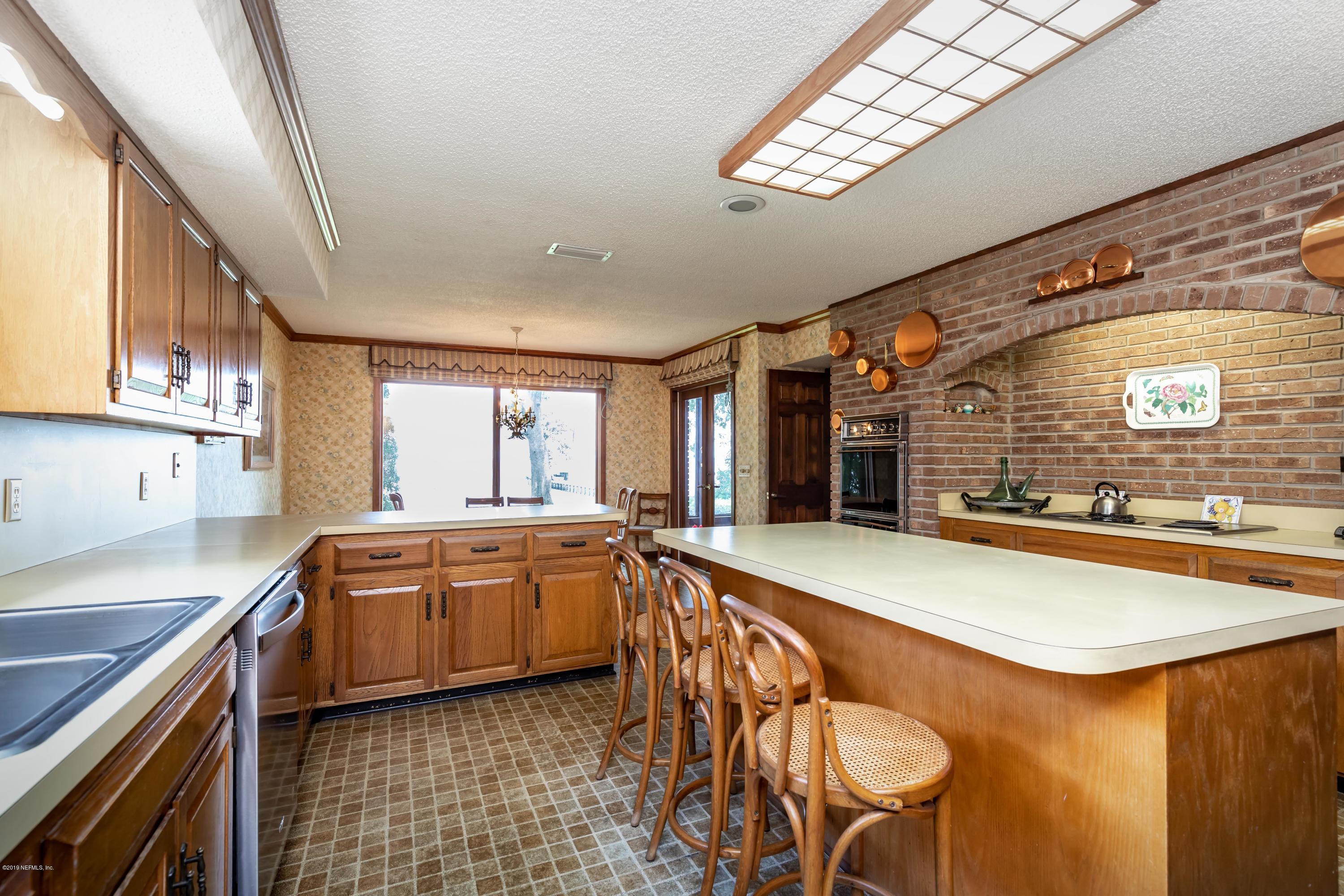 2911 Front Road Jacksonville, FL 32257 - Photo 36 of 71 a large kitchen with stainless steel appliances granite countertop a sink and a stove