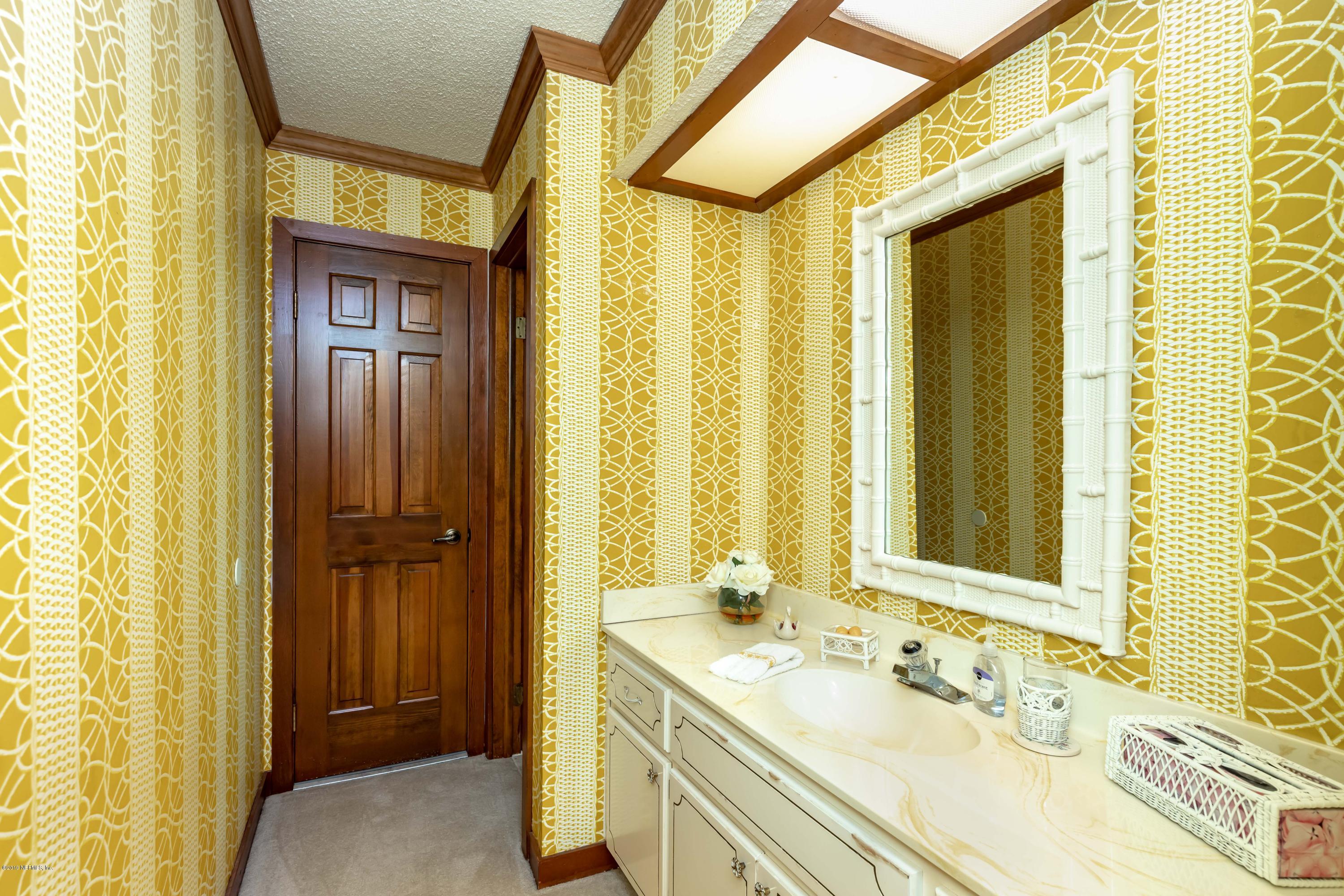 2911 Front Road Jacksonville, FL 32257 - Photo 52 of 71 a bathroom with a granite countertop sink and a mirror
