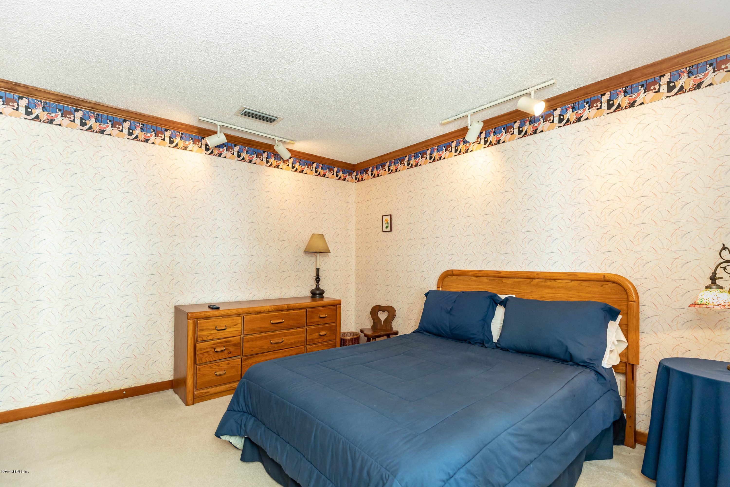 2911 Front Road Jacksonville, FL 32257 - Photo 54 of 71 a bedroom with a bed and a window