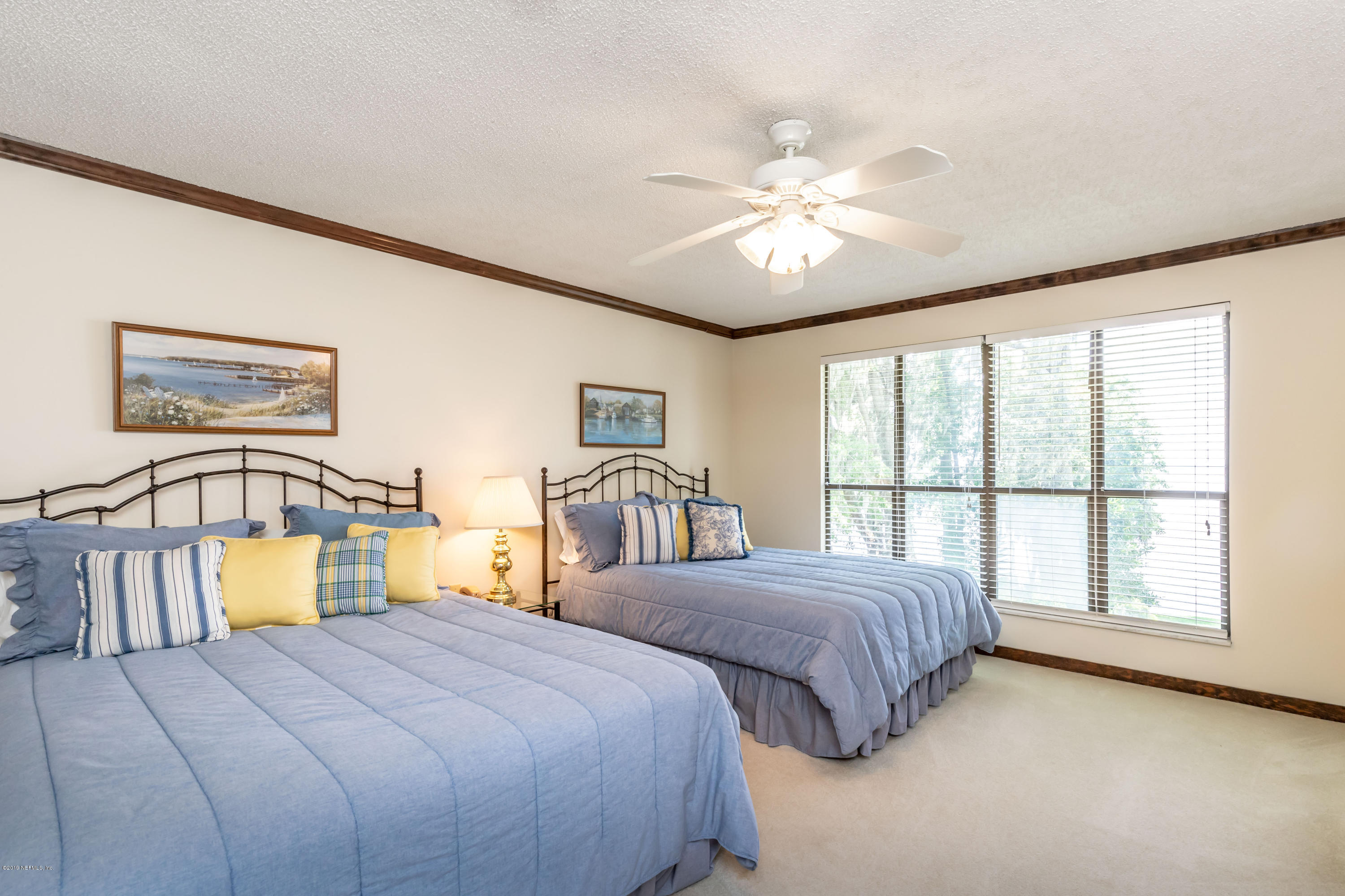 2911 Front Road Jacksonville, FL 32257 - Photo 60 of 71 a bedroom with two beds and a large window