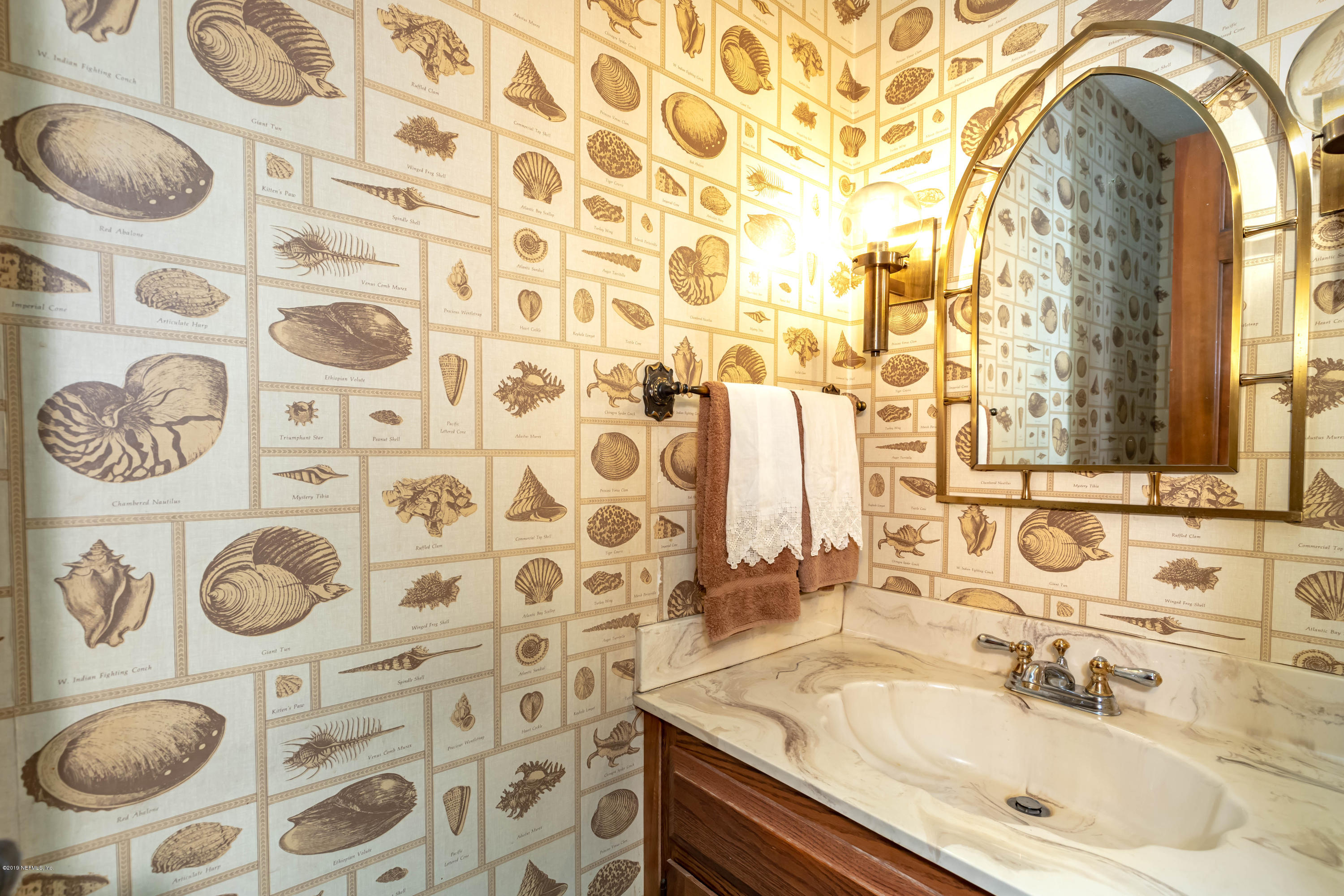 2911 Front Road Jacksonville, FL 32257 - Photo 63 of 71 a bathroom with a sink and a mirror