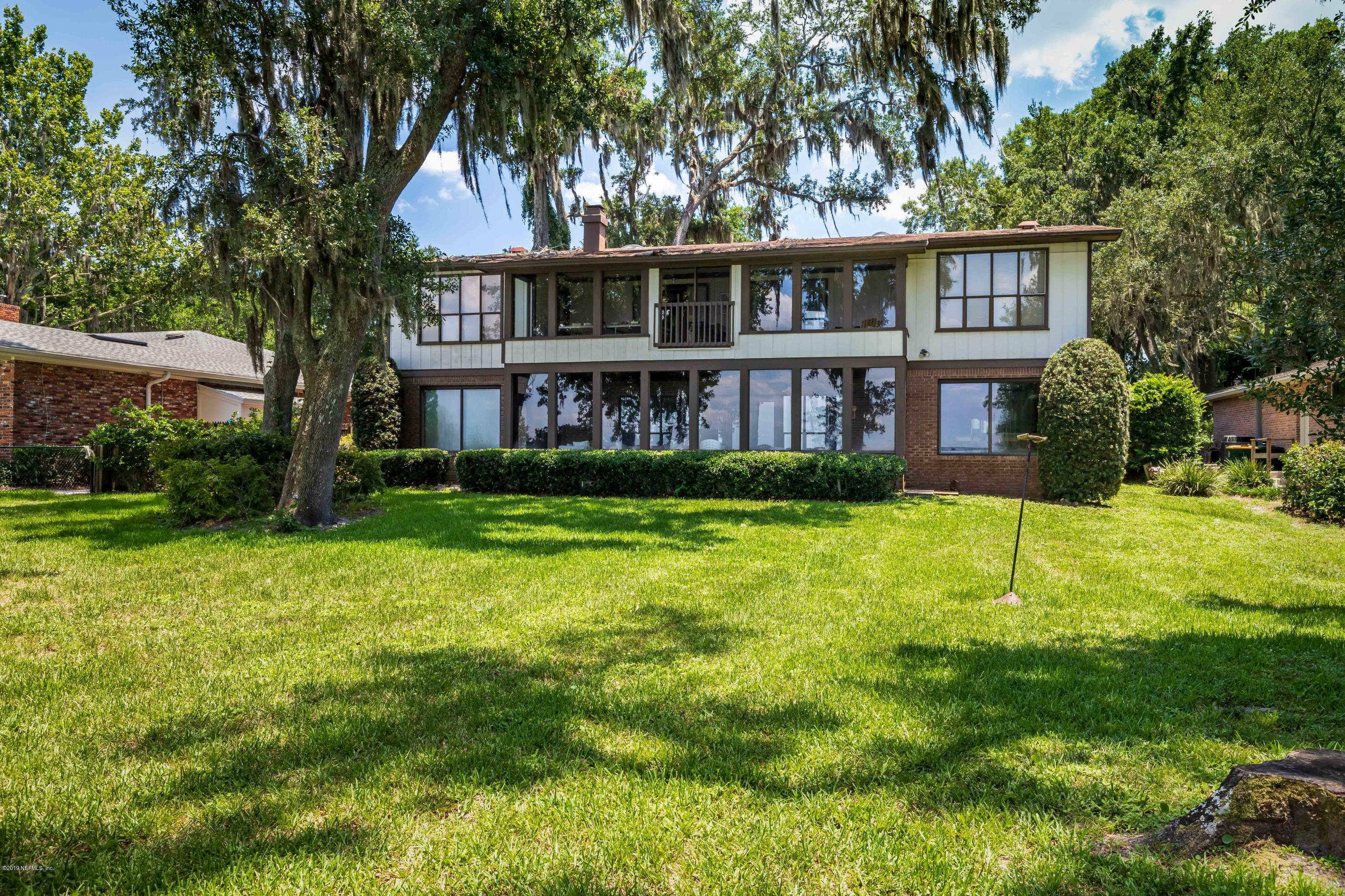 2911 Front Road Jacksonville, FL 32257 - Photo 67 of 71 a view of a house with a yard and potted plants