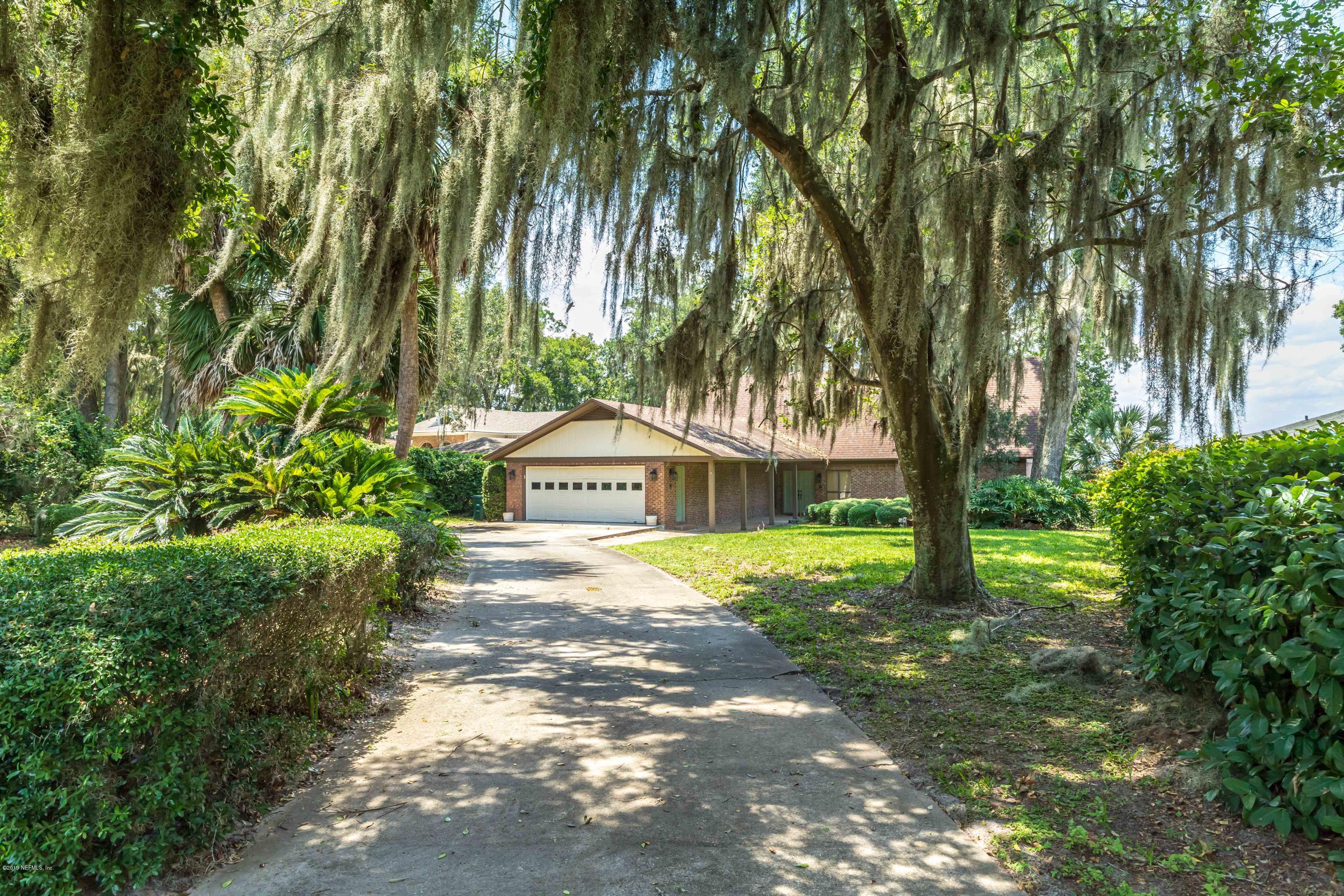 2911 Front Road Jacksonville, FL 32257 - Photo 71 of 71 a view of a house with a yard and large trees