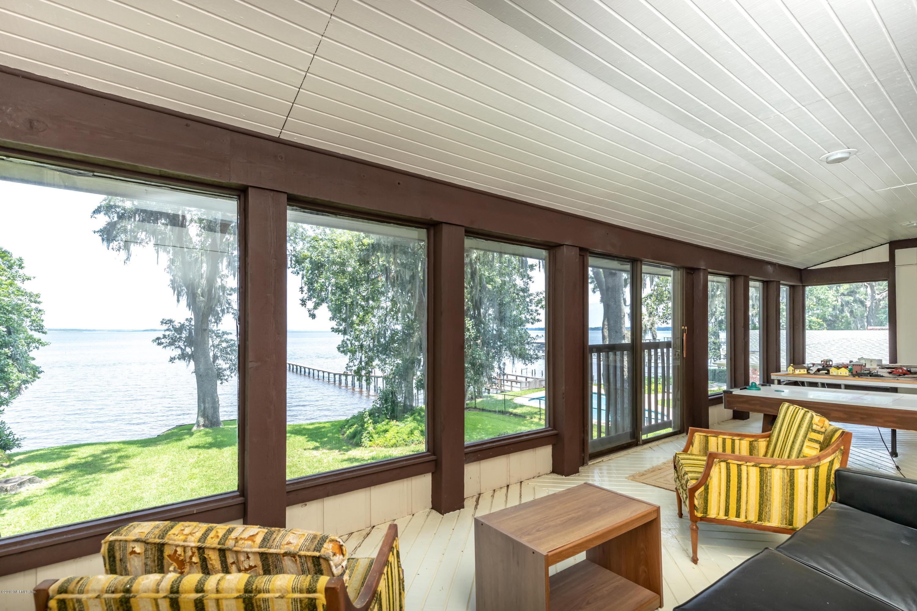 2911 Front Road Jacksonville, FL 32257 - Photo 10 of 71 a living room with furniture and floor to ceiling windows