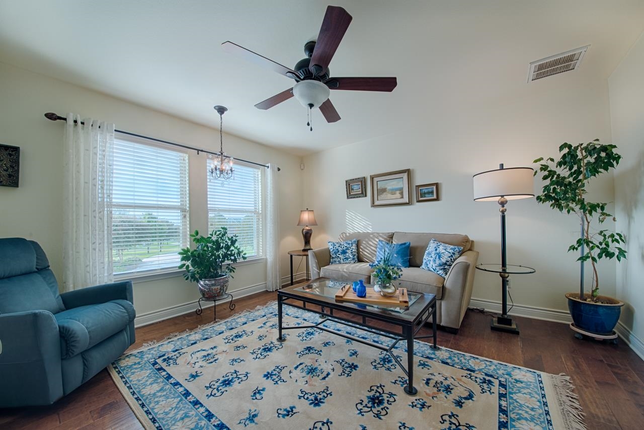 1600 Legends Parkway Kingsland, TX 78639 - Photo 18 of 30 a living room with furniture and wooden floor
