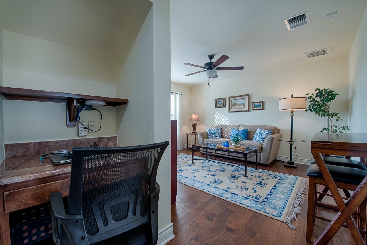 1600 Legends Parkway Kingsland, TX 78639 - Photo 19 of 30 a living room with furniture and a fireplace