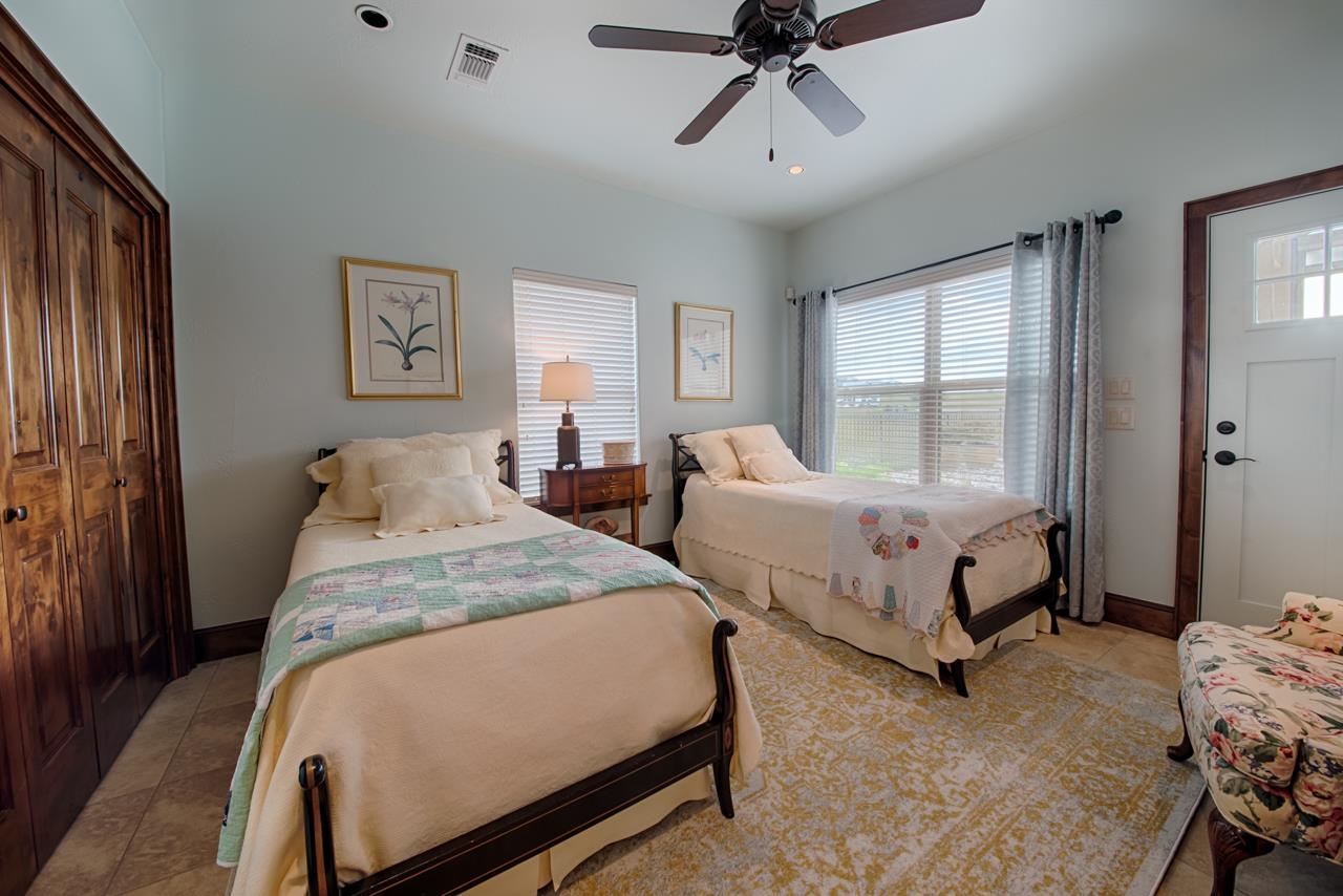 1600 Legends Parkway Kingsland, TX 78639 - Photo 26 of 30 a bedroom with two beds and windows