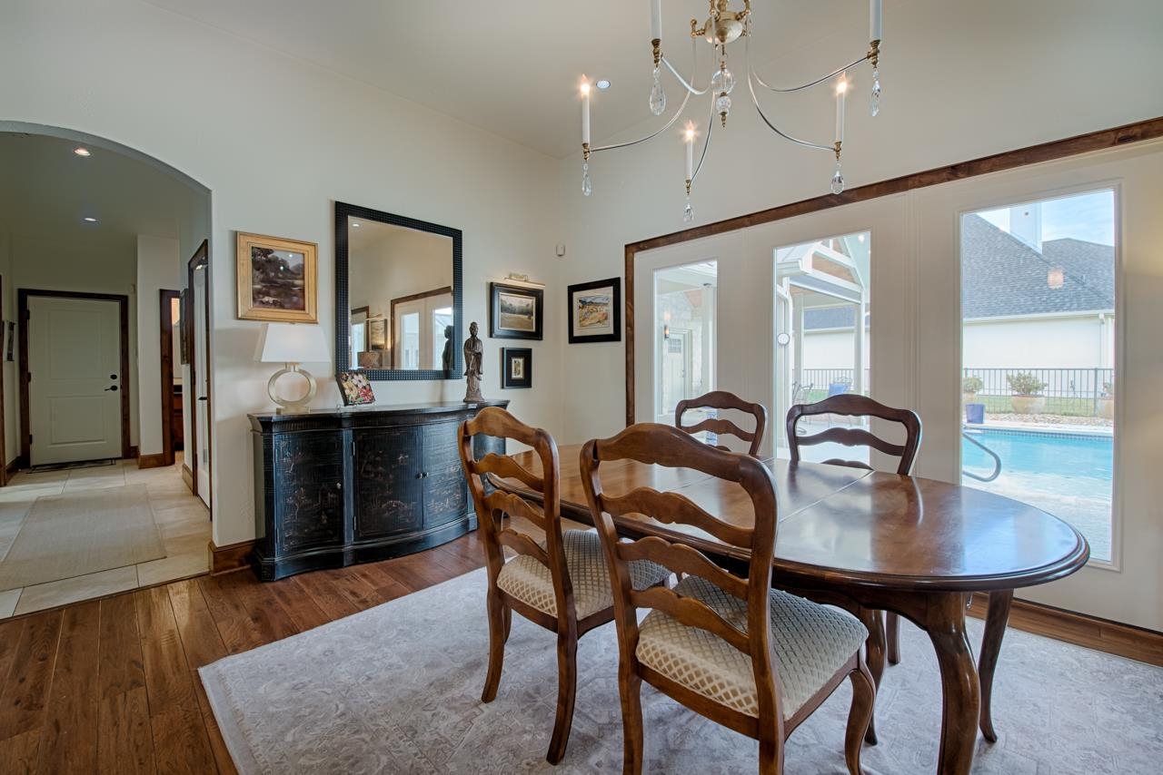 1600 Legends Parkway Kingsland, TX 78639 - Photo 4 of 30 a view of a dining room with furniture and wooden floor