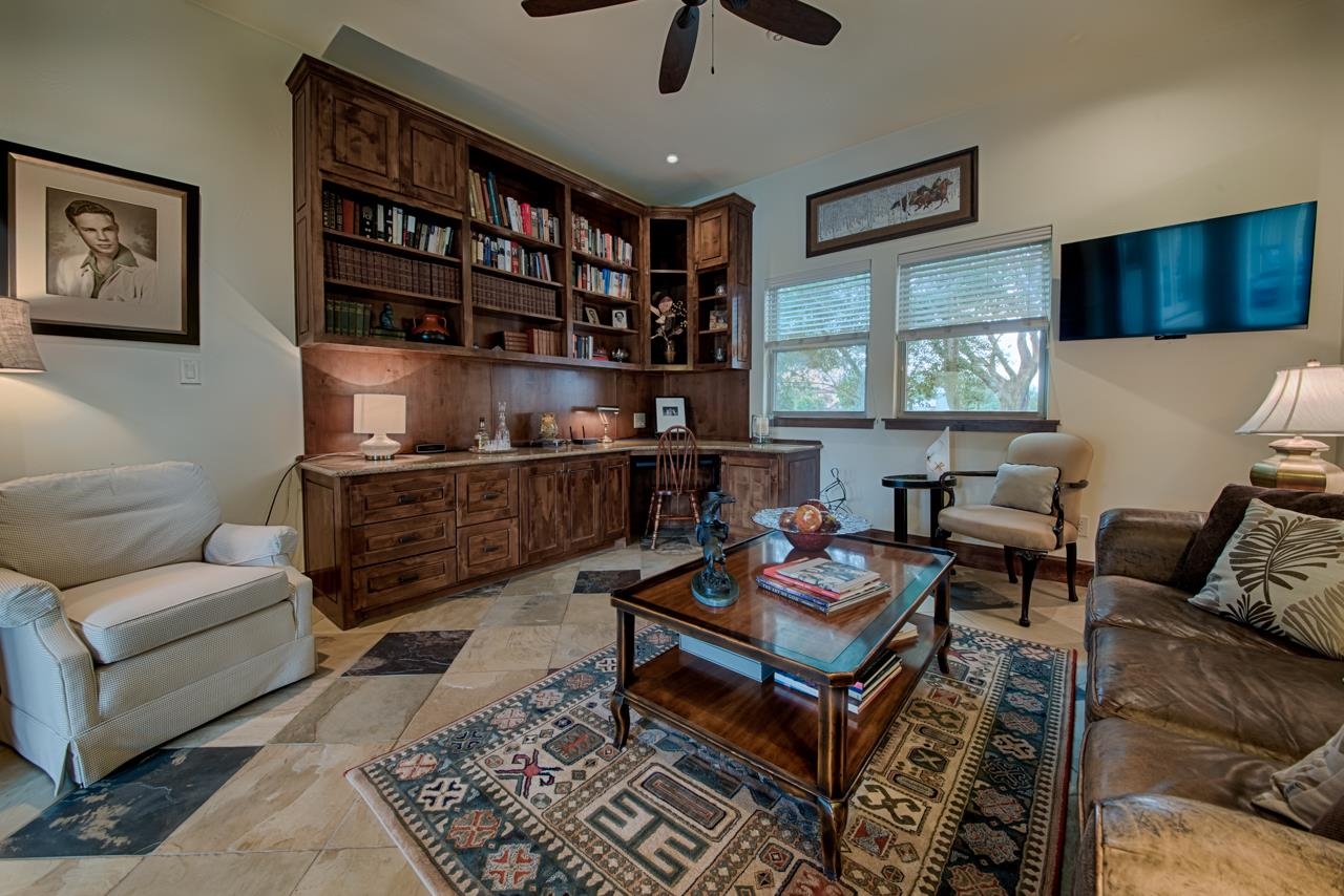 1600 Legends Parkway Kingsland, TX 78639 - Photo 10 of 30 a living room with furniture a rug and a bookshelf