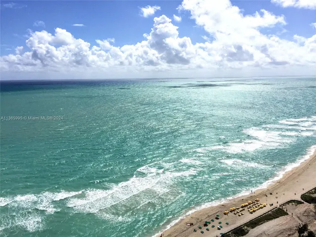 a view of a lake from a balcony