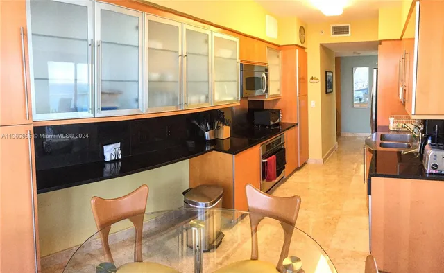 a view of an chairs and table in the balcony