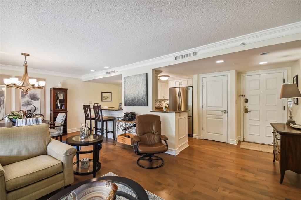 36750 Highway 19, Unit 23213 Palm Harbor, FL 34684 - Photo 12 of 73 a living room with furniture and a wooden floor
