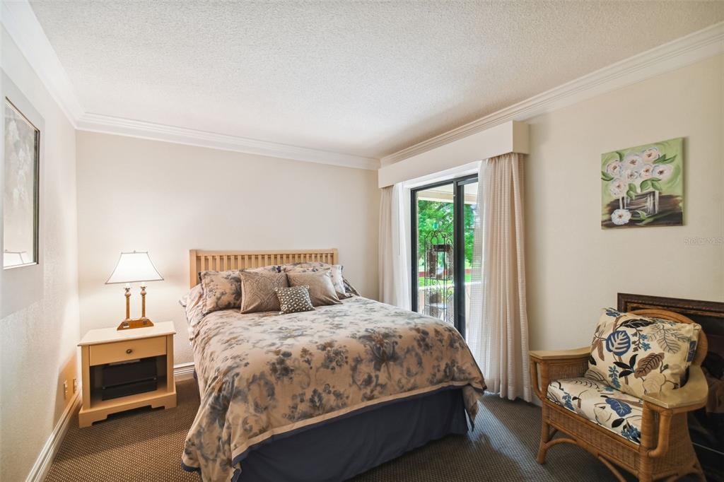 36750 Highway 19, Unit 23213 Palm Harbor, FL 34684 - Photo 28 of 73 a bedroom with a bed and a couch