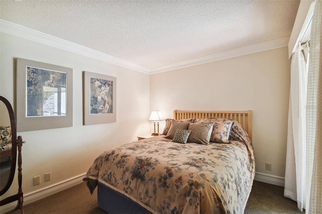 36750 Highway 19, Unit 23213 Palm Harbor, FL 34684 - Photo 29 of 73 a bed sitting in a bedroom next to a window